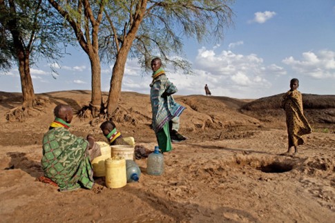 02 Women girls fetching water dry riverbed